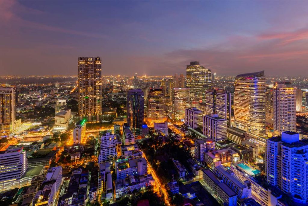 Aerial view of Sathorn district, Bangkok Downtown. Thailand. Financial district and business centers in smart urban city in Asia. Skyscraper and high-rise buildings at night.