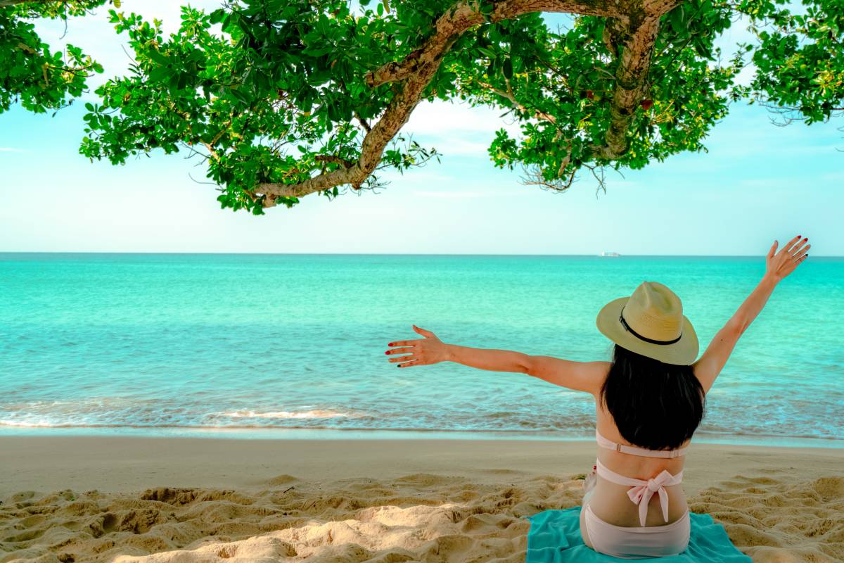 back-view-of-happy-young-asian-woman-in-pink-swims-2023-11-27-05-19-40-utc (1)